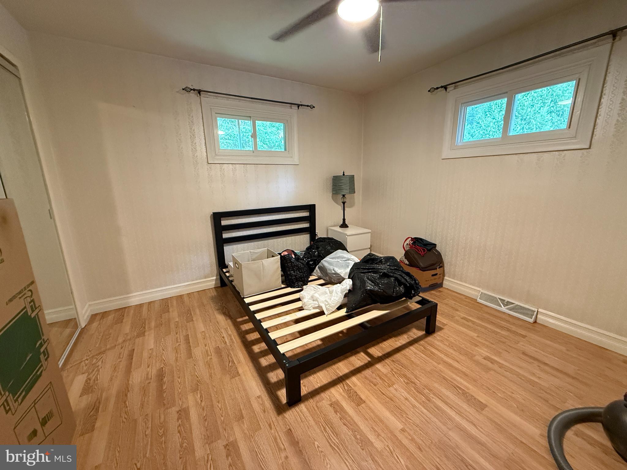 1667 Beacon Hill Road Downingtown, PA 19335 - Photo 5 of 23 a bedroom with wooden floor and window