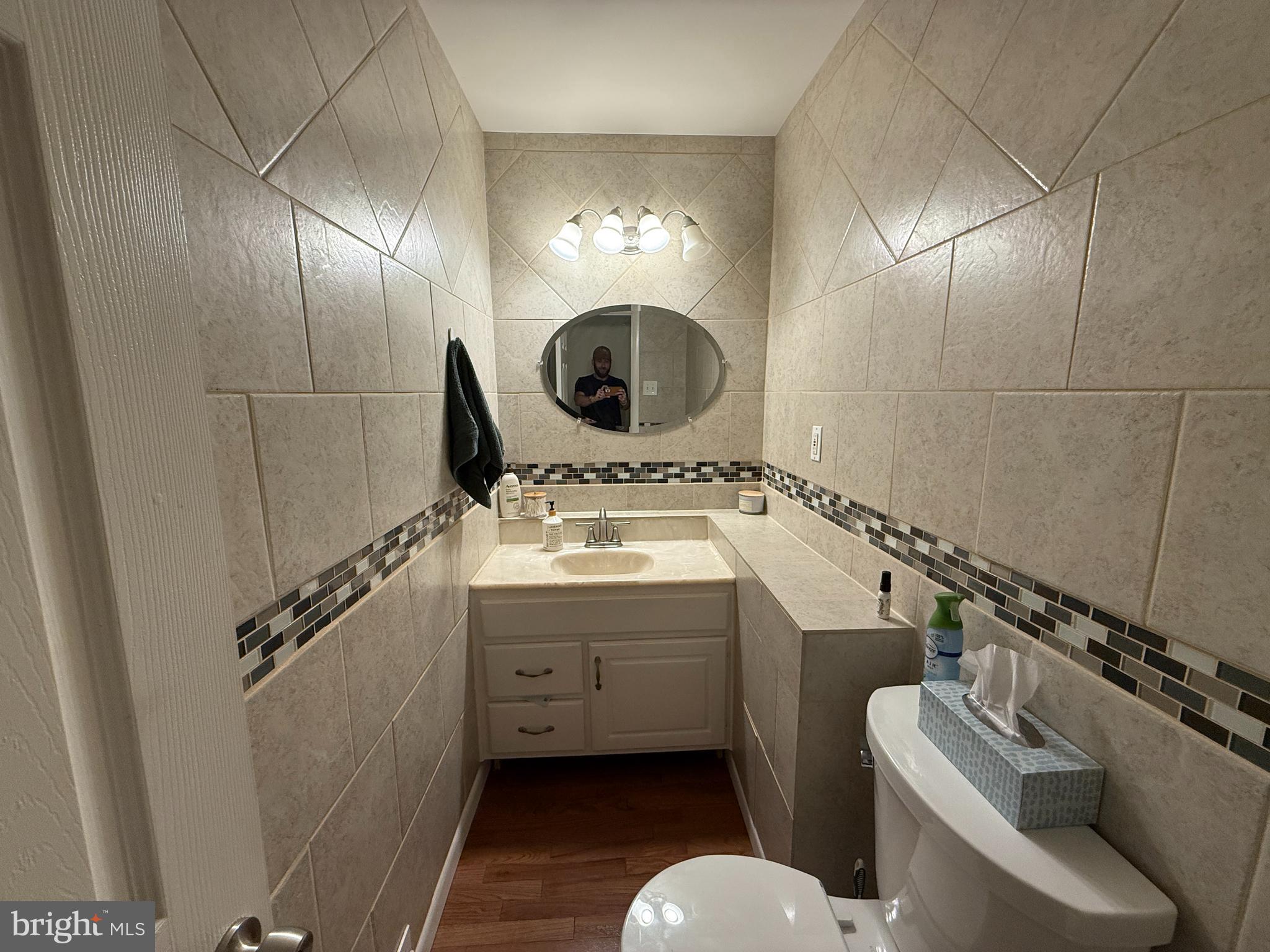 1667 Beacon Hill Road Downingtown, PA 19335 - Photo 8 of 23 a bathroom with a sink mirror vanity and toilet