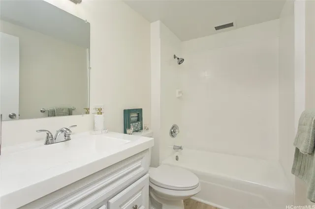a bathroom with a sink a toilet and a bathtub