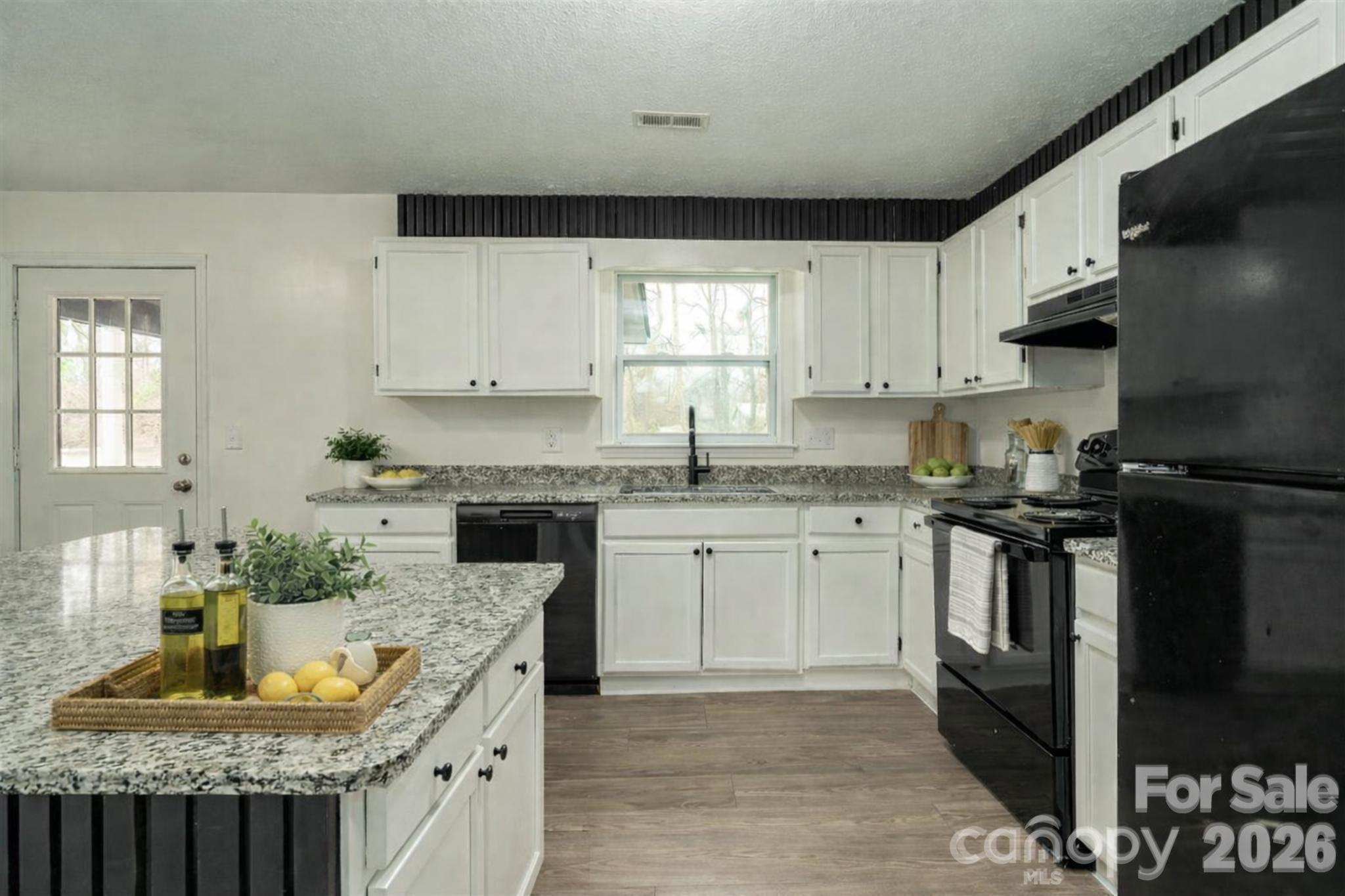 3115 Crestview Drive Florence, SC 29501 - Photo 13 of 35 a kitchen with granite countertop a sink stove and cabinets