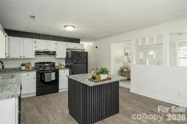 a bathroom with a sink toilet vanity and bathtub
