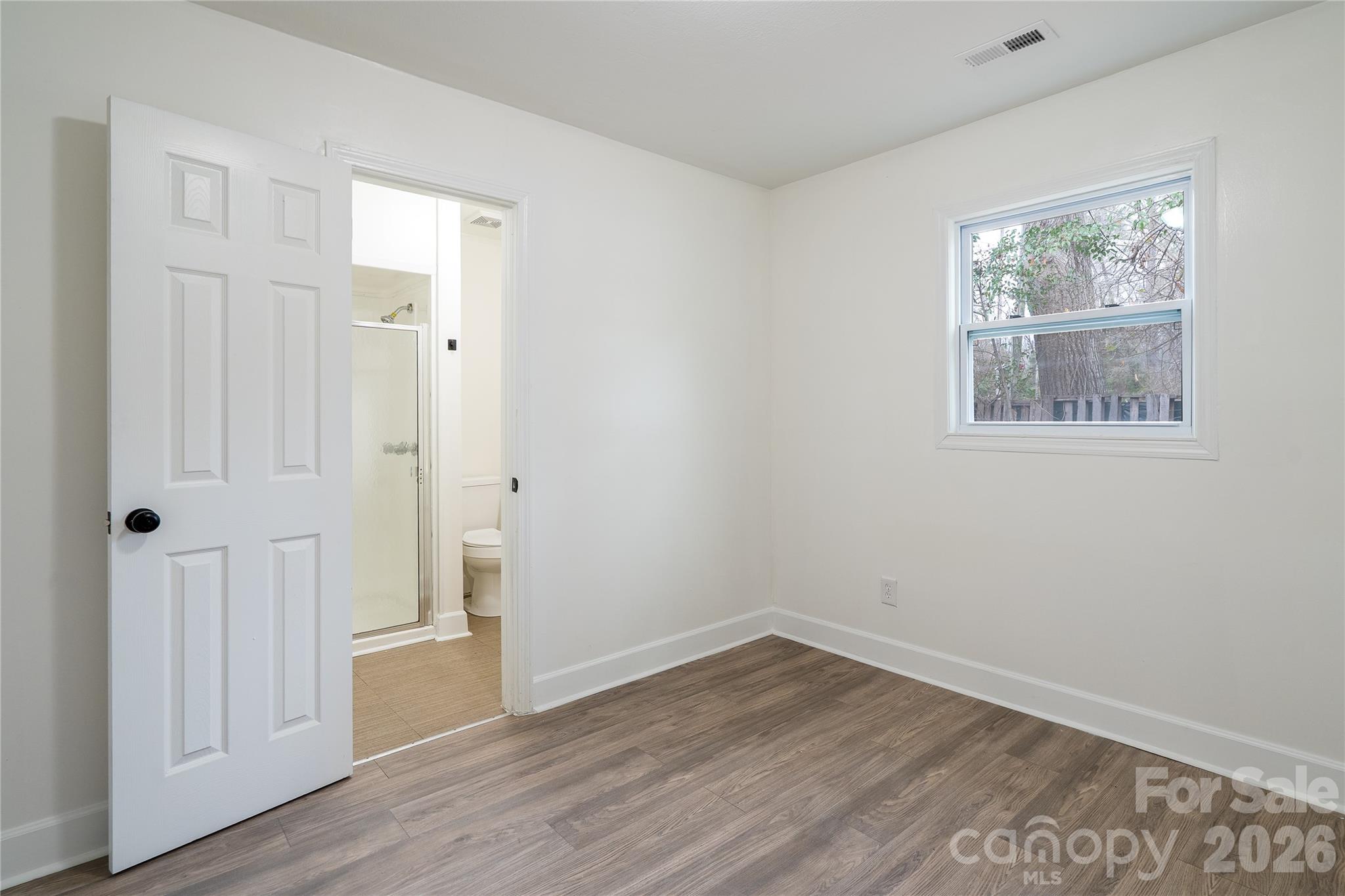 3115 Crestview Drive Florence, SC 29501 - Photo 22 of 35 a view of empty room with wooden floor and window
