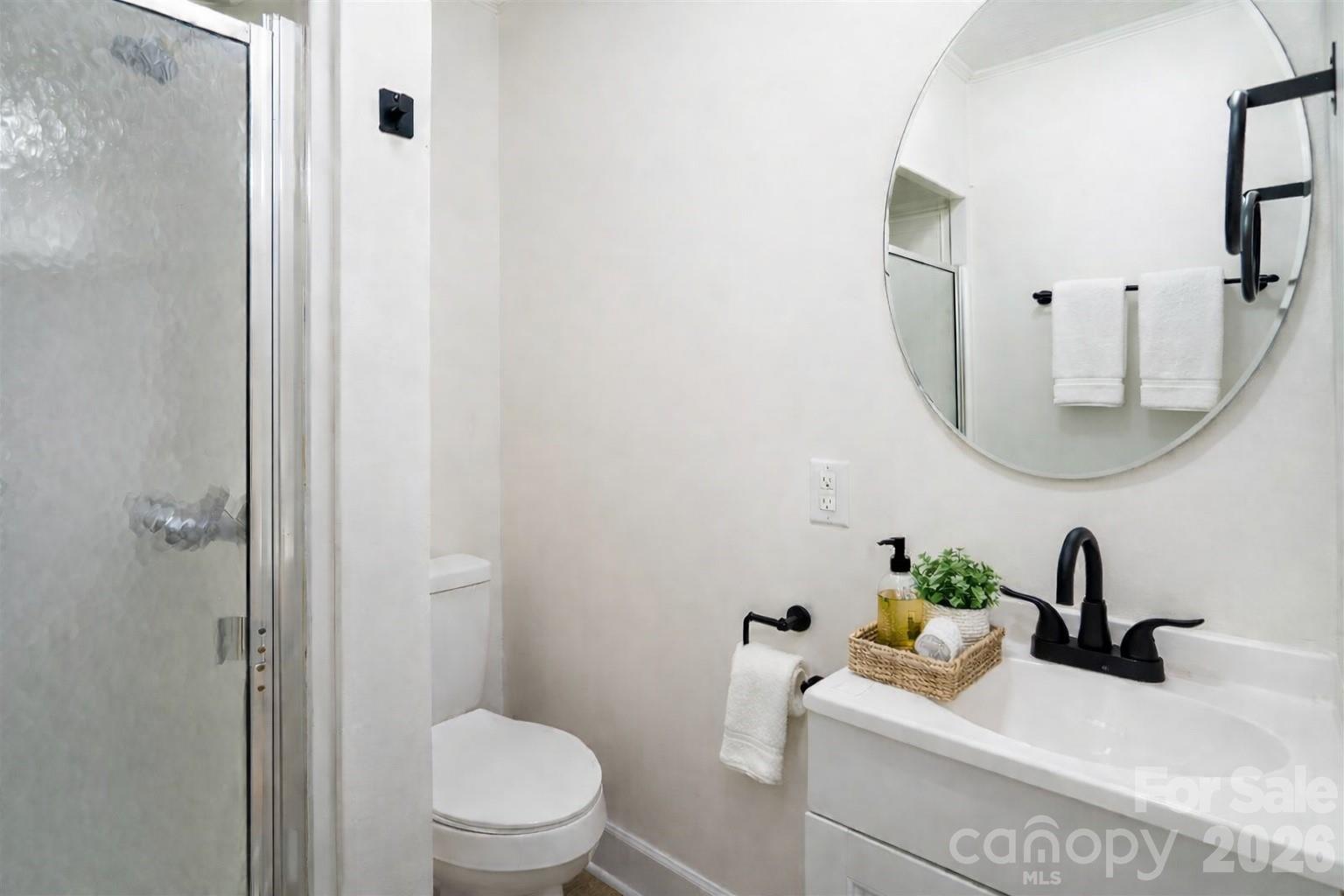 3115 Crestview Drive Florence, SC 29501 - Photo 23 of 35 a bathroom with a sink a toilet and a mirror