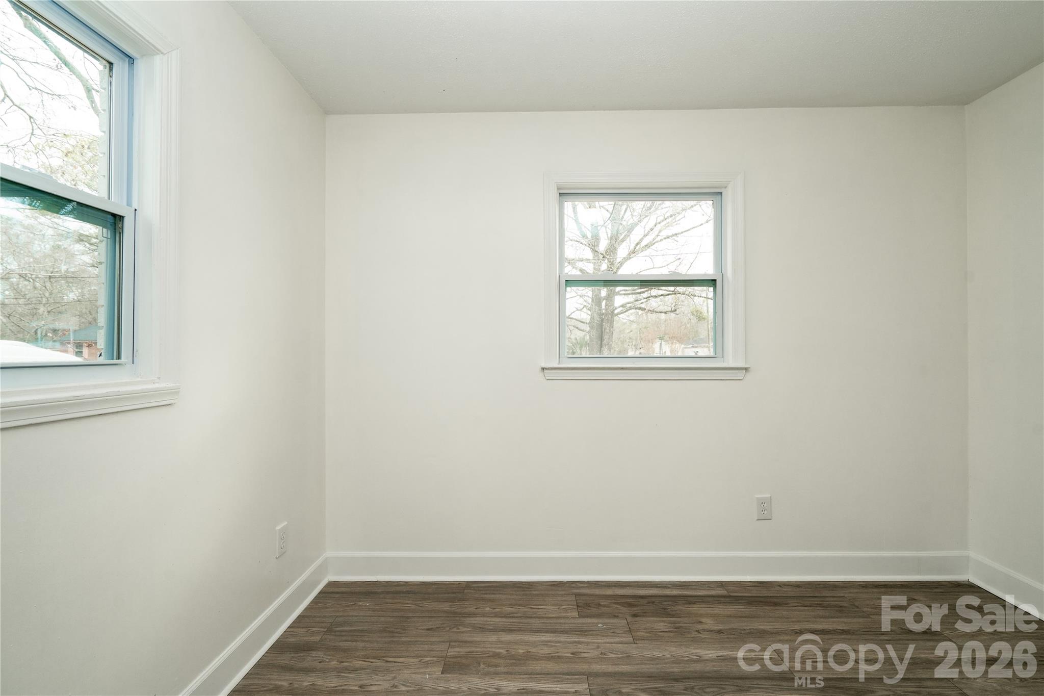 3115 Crestview Drive Florence, SC 29501 - Photo 28 of 35 an empty room with wooden floor and windows