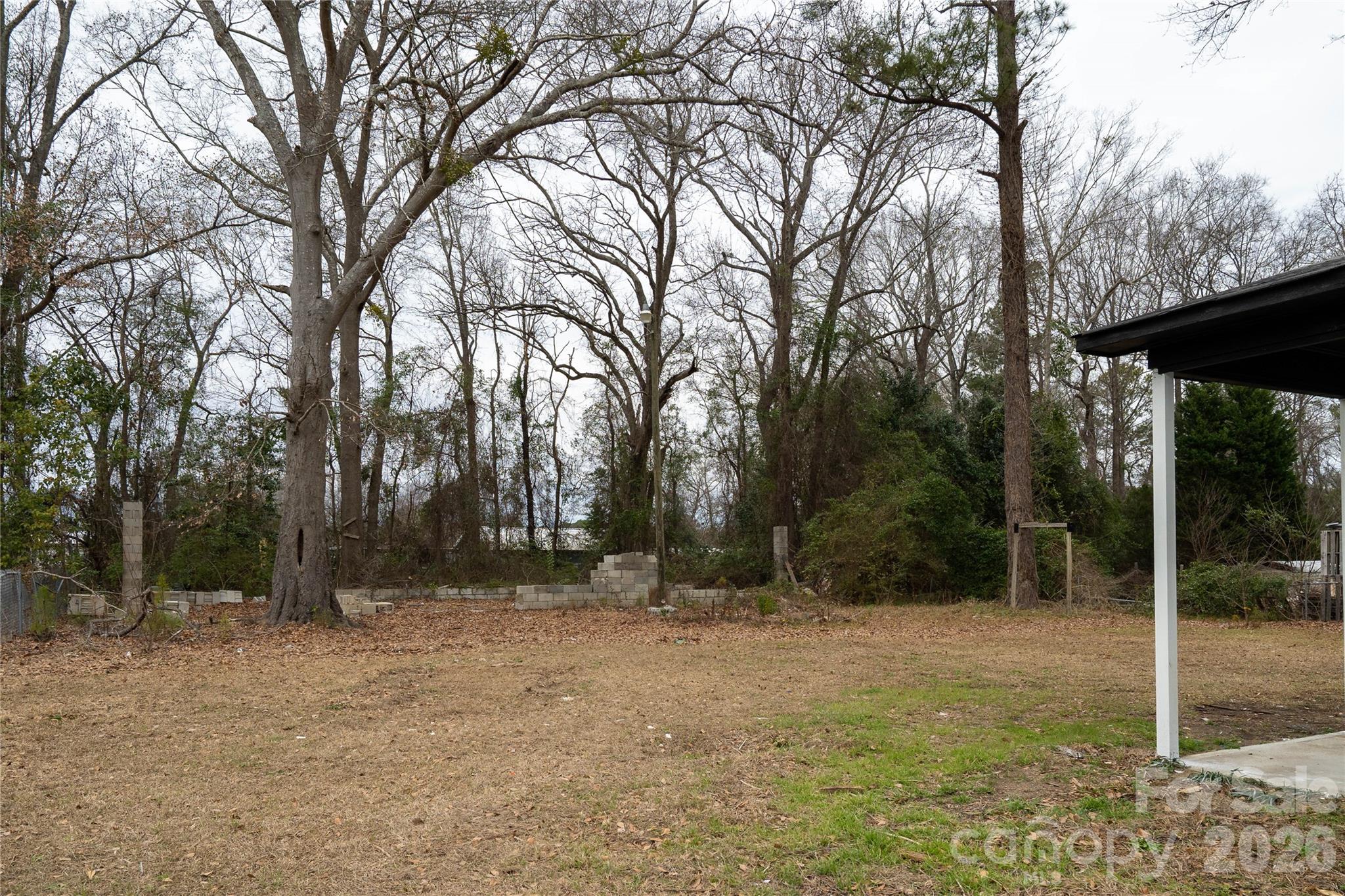 3115 Crestview Drive Florence, SC 29501 - Photo 30 of 35 a backyard of a house with lots of trees