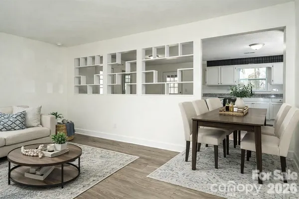 a view of kitchen with granite countertop cabinets and wooden floor