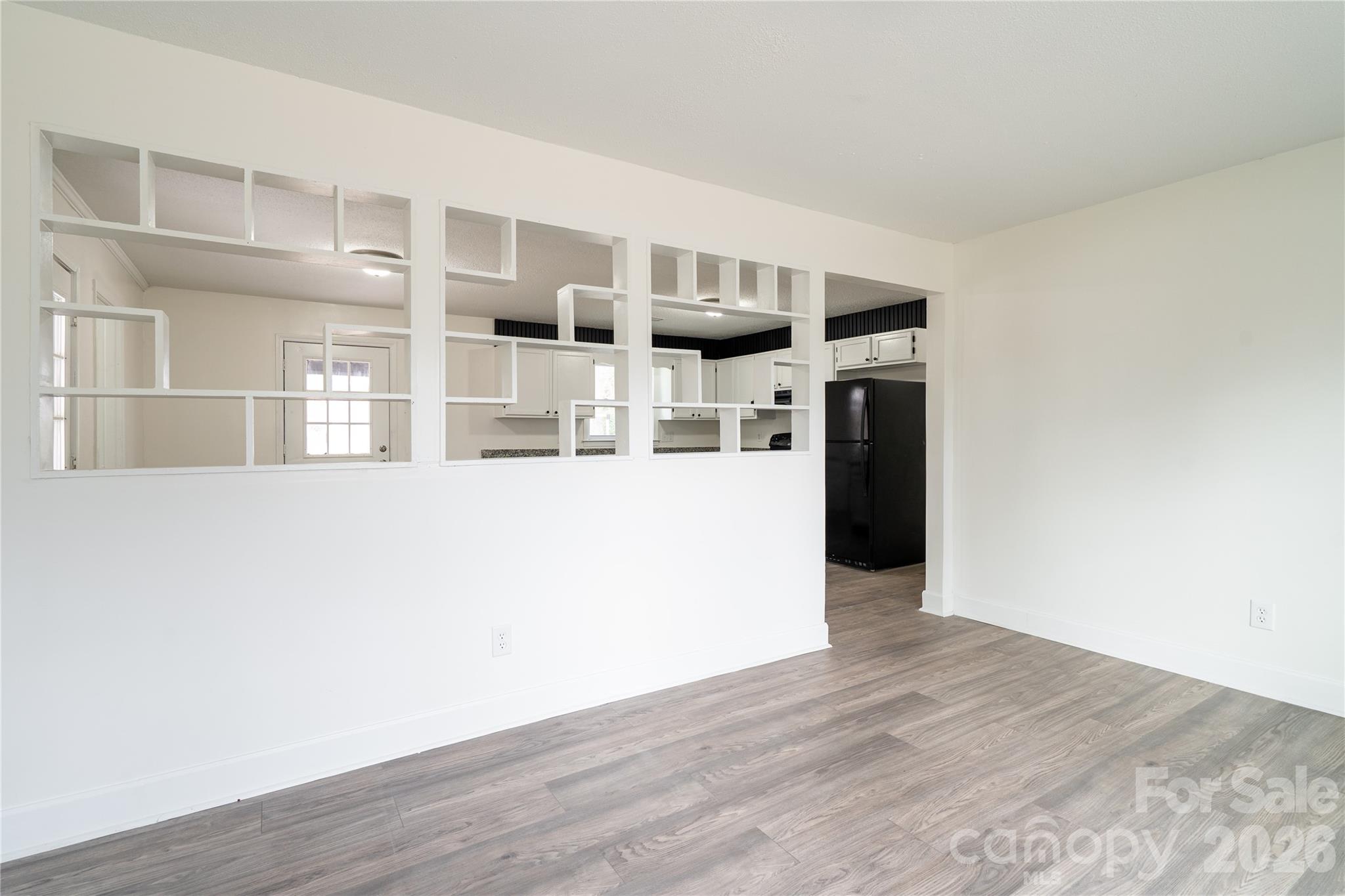 3115 Crestview Drive Florence, SC 29501 - Photo 8 of 35 a view of a kitchen with wooden floor and cabinets