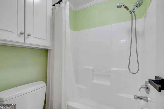 a bathroom with a granite countertop sink mirror and double
