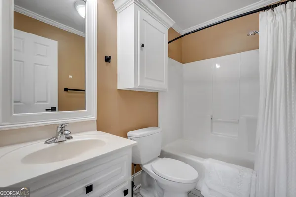 a bathroom with a granite countertop sink mirror and double