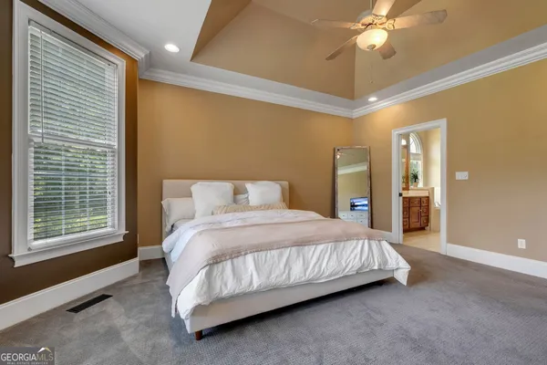 a bathroom with a tub a sink shower and mirror