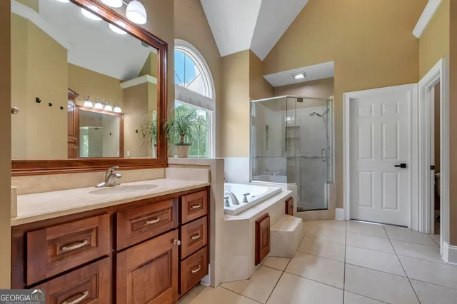 a bathroom with a sink mirror and toilet