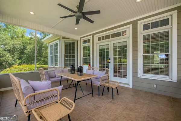 a view of a swimming pool with a table and chairs