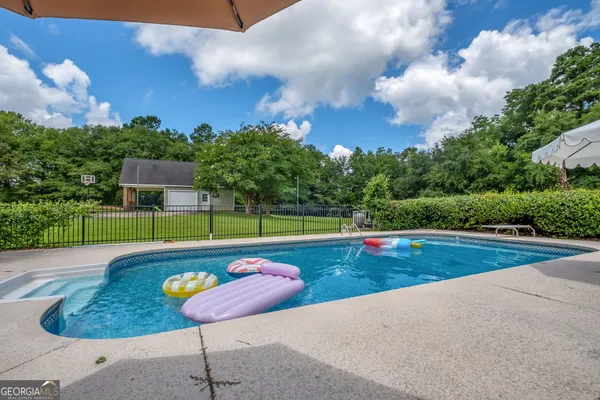 a view of a house with a big yard