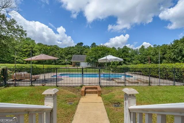 a view of a house with a big yard
