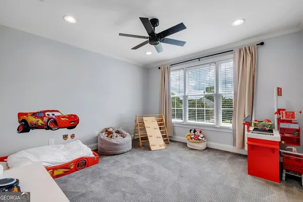 a bed room with a bed and a large window