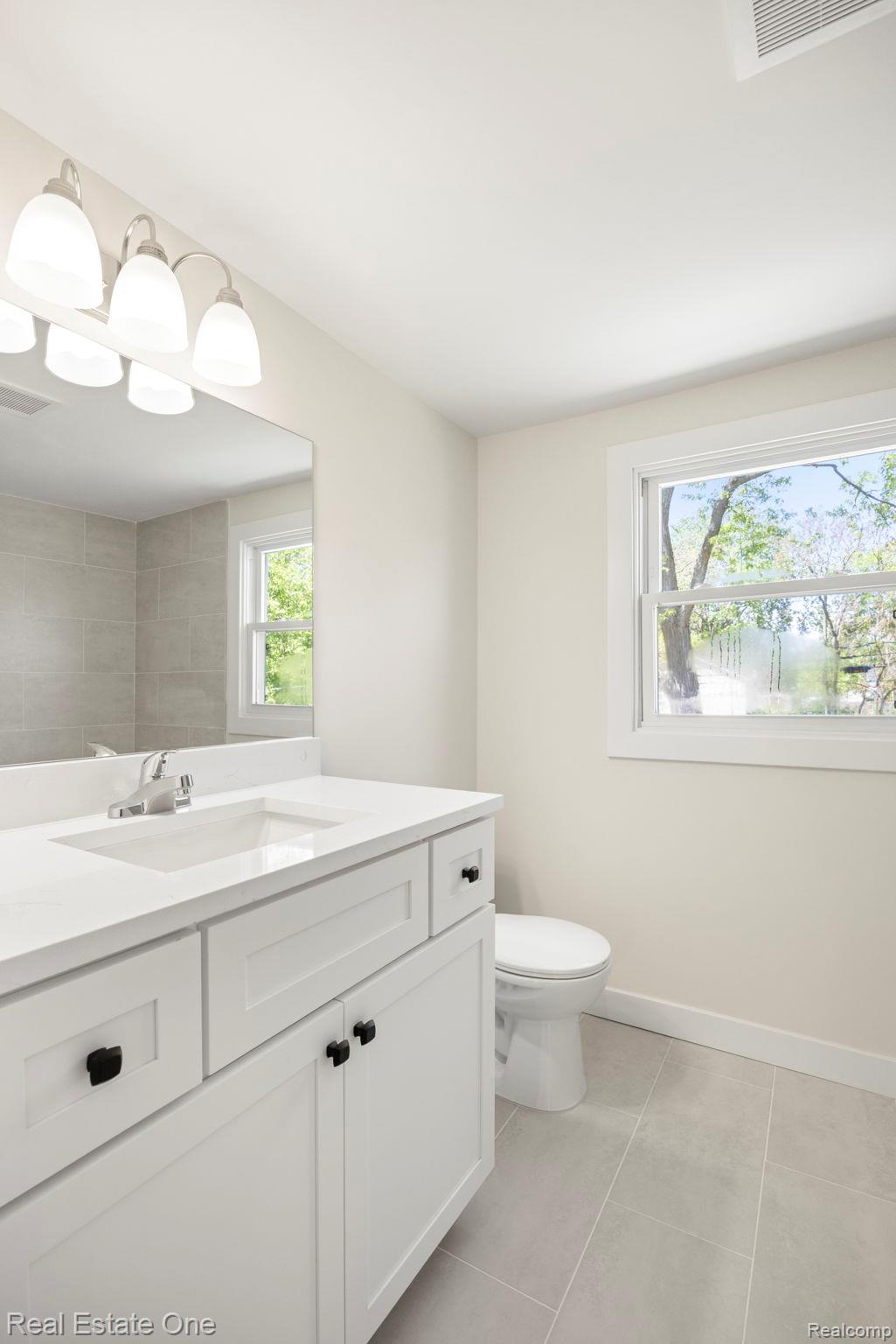 3200 Hessel Avenue Rochester, MI 48307 - Photo 20 of 32 Bathroom featuring vanity and light tile patterned flooring