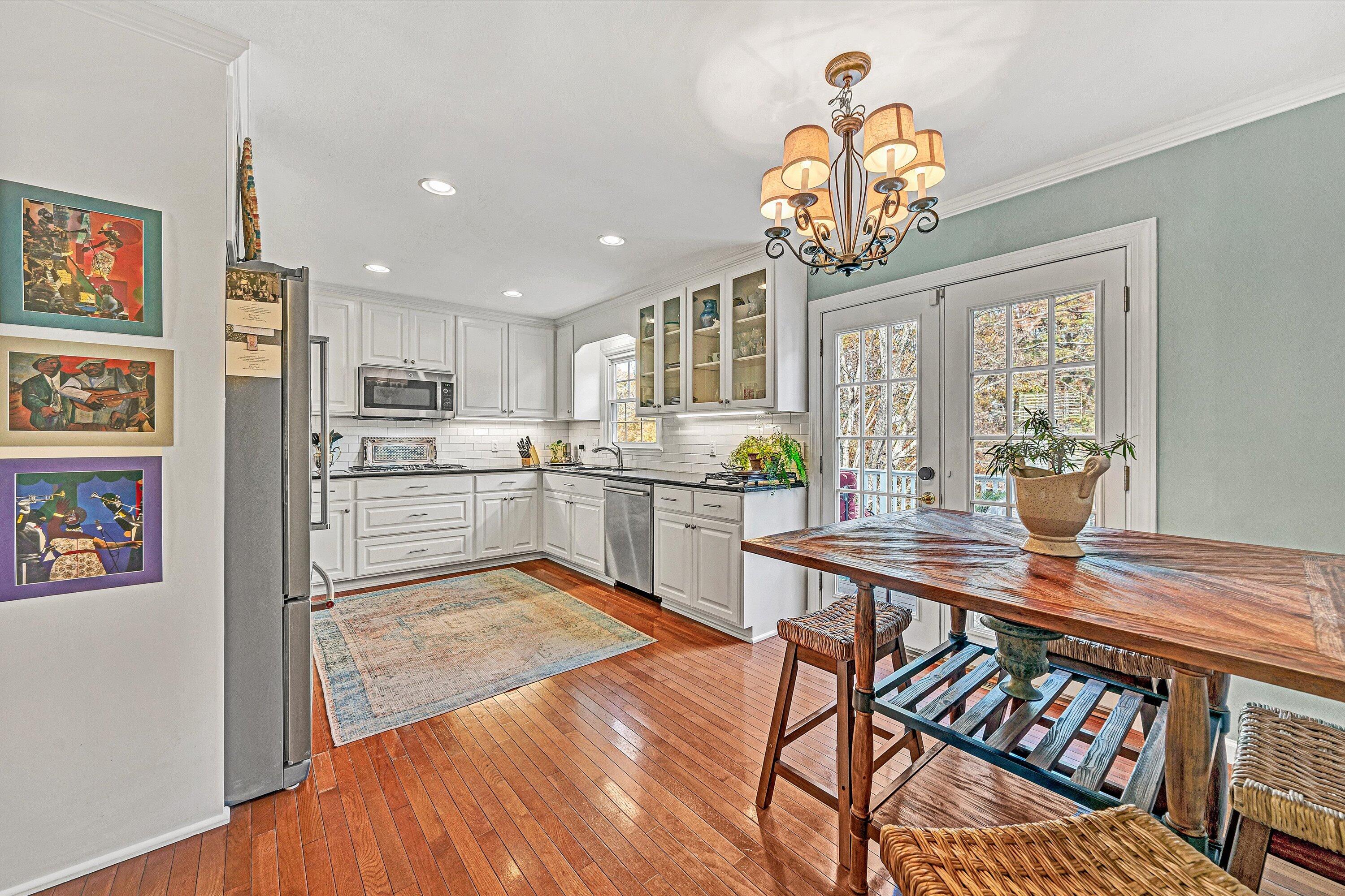 727 White Oak Road Southwest Roanoke, VA 24014 - Photo 15 of 52 a kitchen with stainless steel appliances granite countertop a refrigerator and a stove top oven