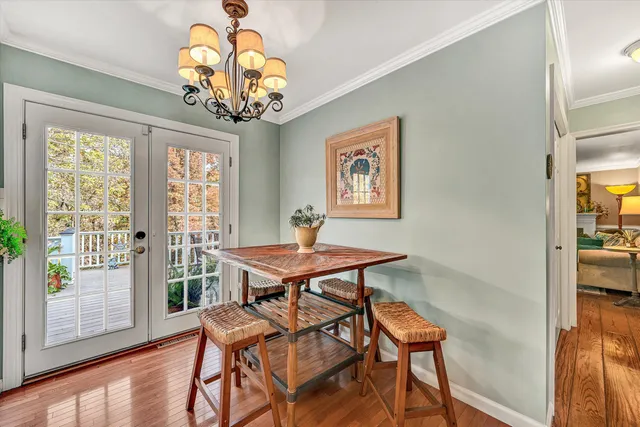 a bedroom with a bed dresser and a window