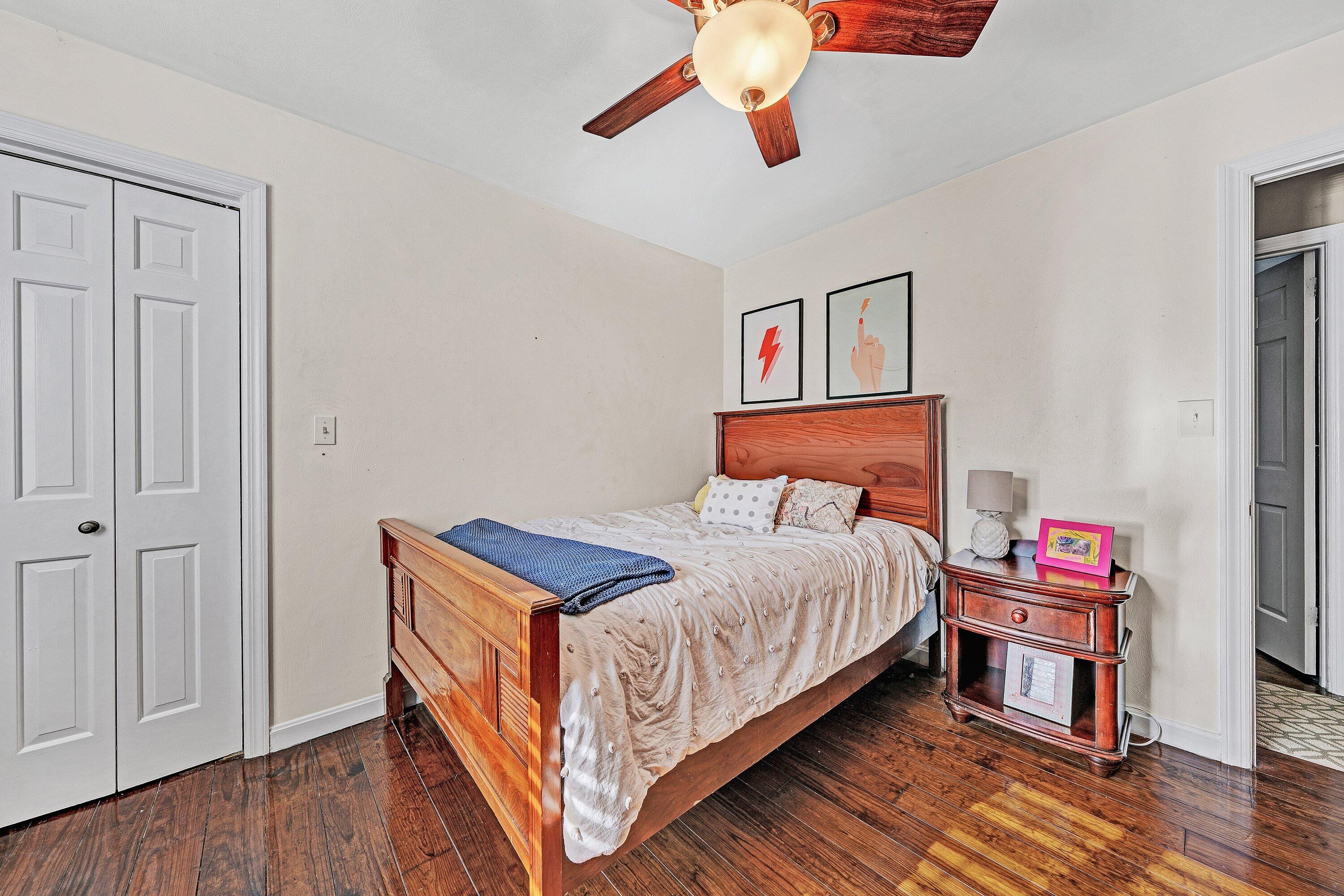 727 White Oak Road Southwest Roanoke, VA 24014 - Photo 33 of 52 a bedroom with a bed and wooden floor