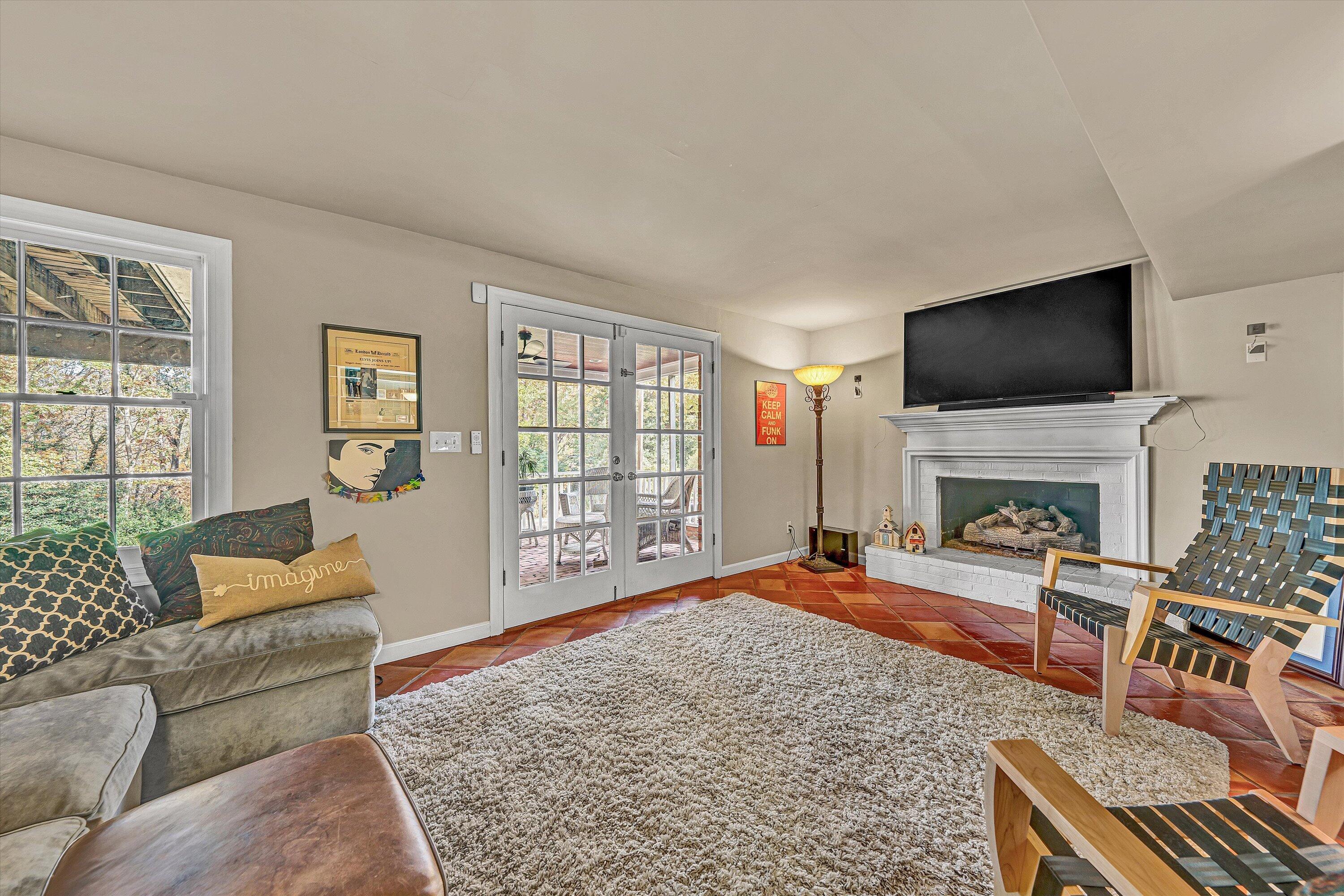 727 White Oak Road Southwest Roanoke, VA 24014 - Photo 37 of 52 a living room with furniture a flat screen tv and a fireplace