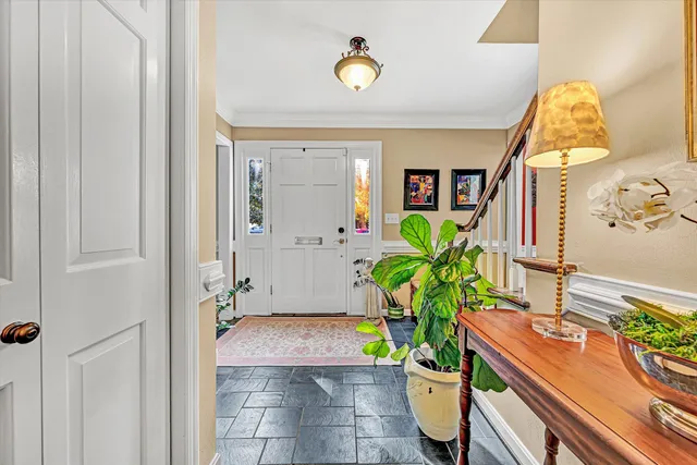 a bathroom with a toilet a sink and a mirror