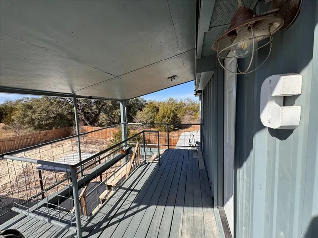 a view of balcony with wooden floor
