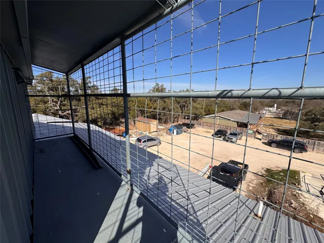 a view of a balcony with chairs