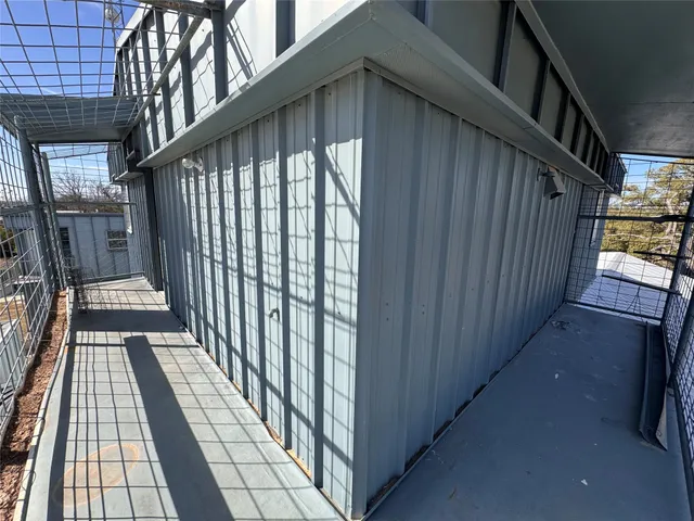 a view of a balcony with wooden floor