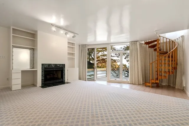a view of empty room with floor to ceiling window