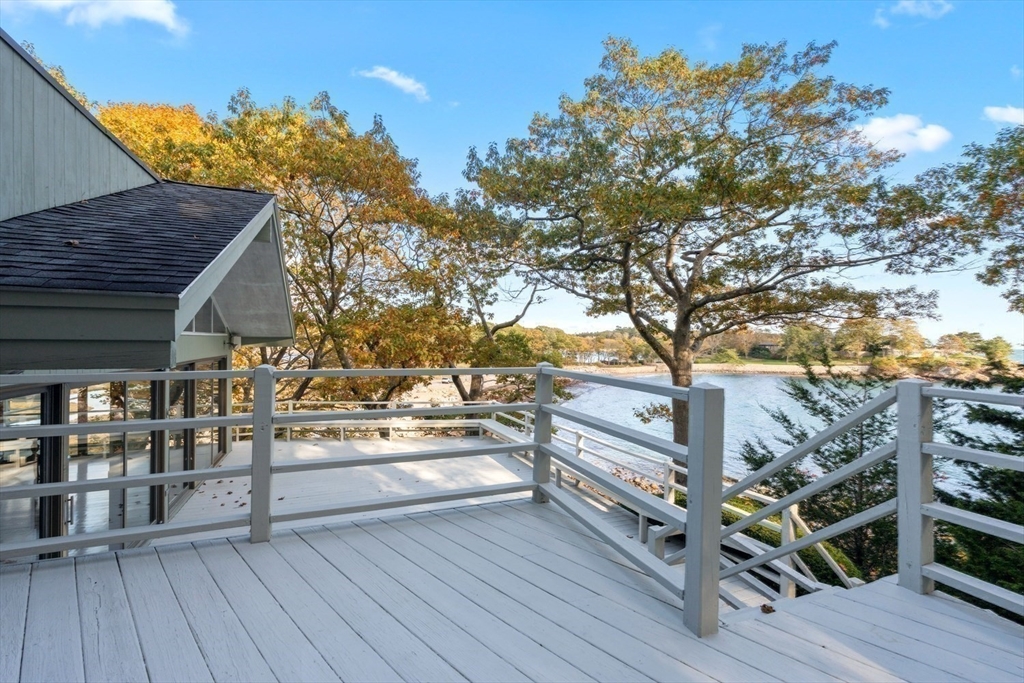 23 Ocean Street Manchester, MA 01944 - Photo 15 of 22 a view of a balcony with wooden floor and fence