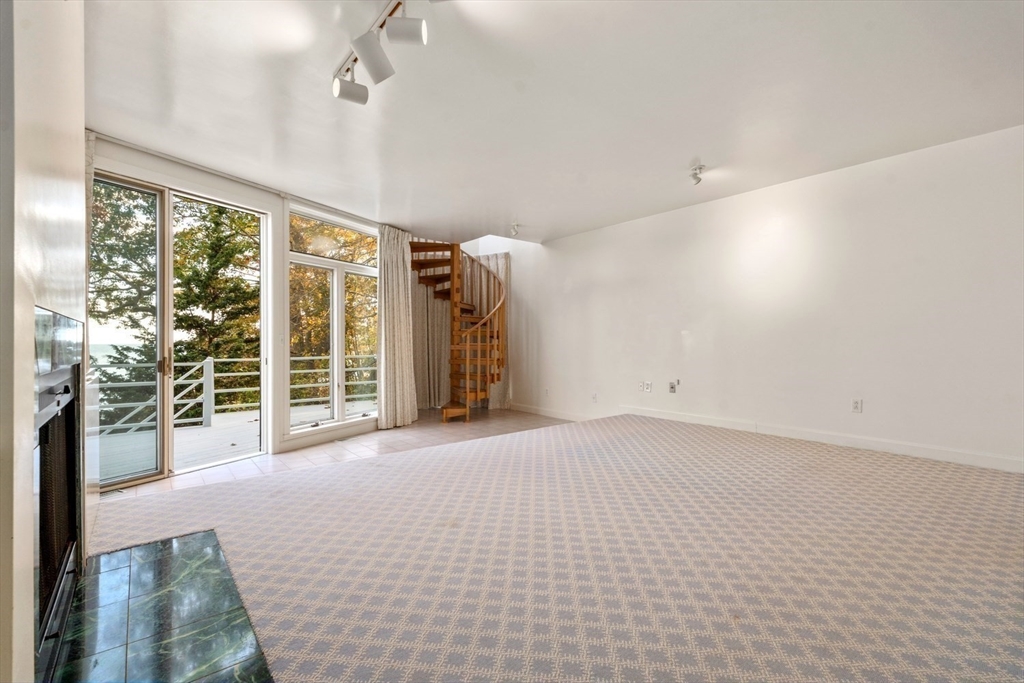 23 Ocean Street Manchester, MA 01944 - Photo 16 of 23 a view of empty room with floor to ceiling window