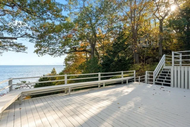 a living room with furniture and large windows