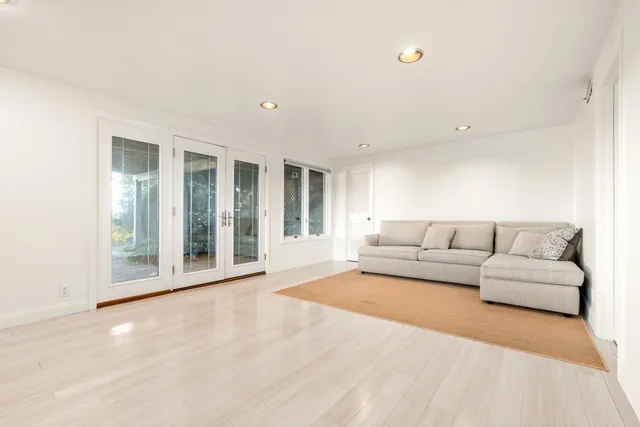 a bedroom with a bed and a couch