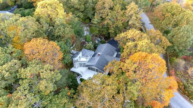 an aerial view of a house with a ocean view