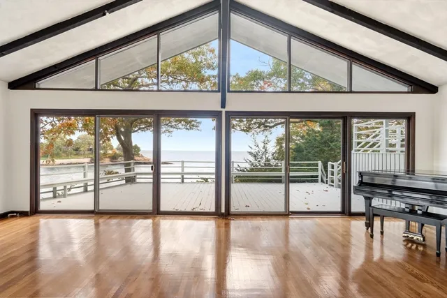 wooden floor in an empty room with a fireplace