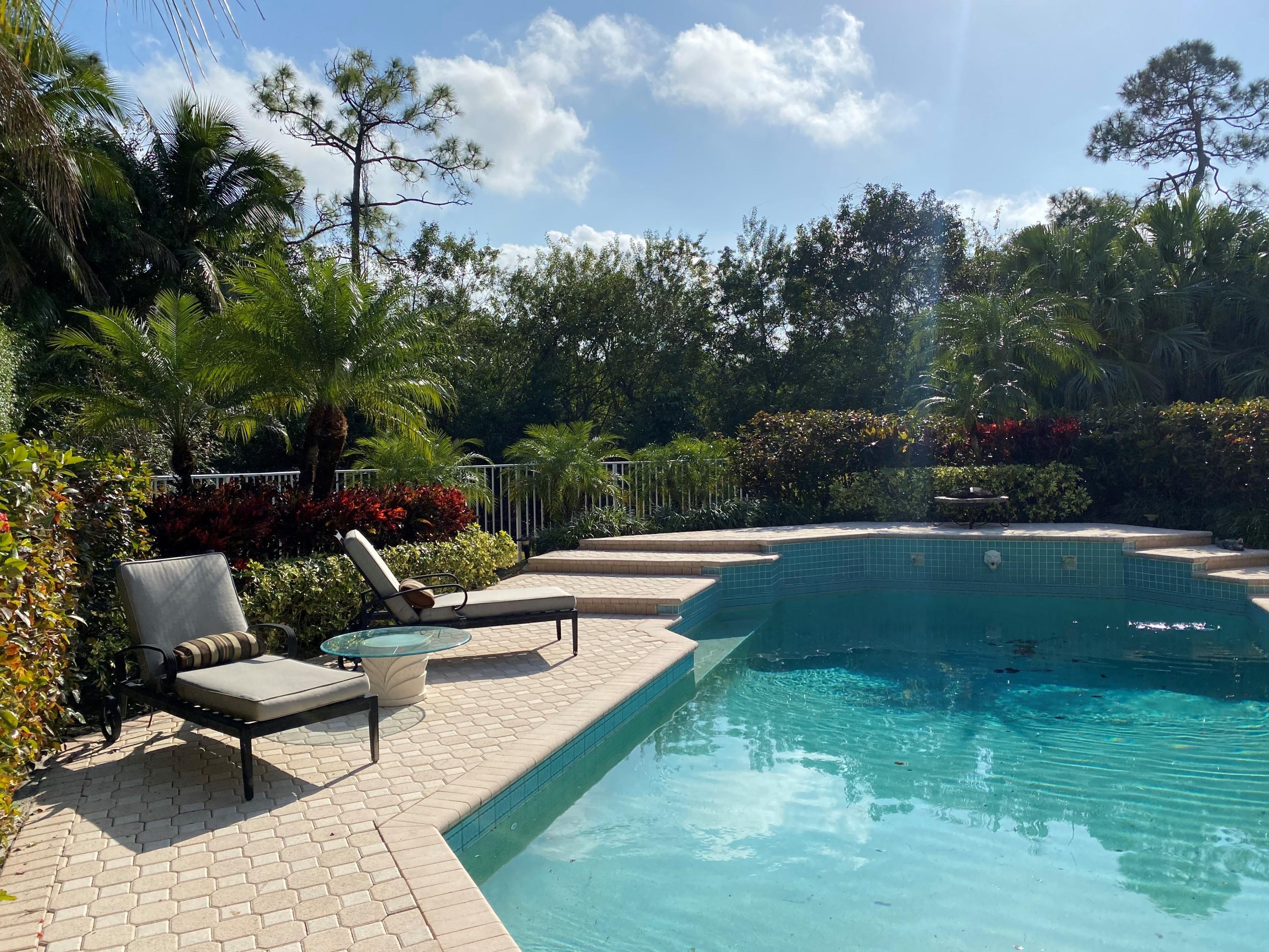 5900 Our Robbies Road Jupiter, FL 33458 - Photo 11 of 53 a view of a patio with couches and a fire pit