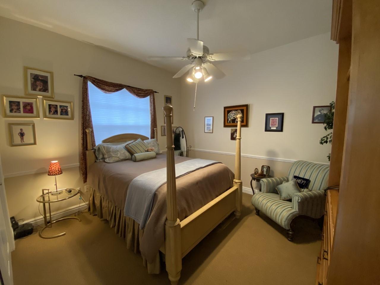 5900 Our Robbies Road Jupiter, FL 33458 - Photo 12 of 53 a bedroom with a bed and couch