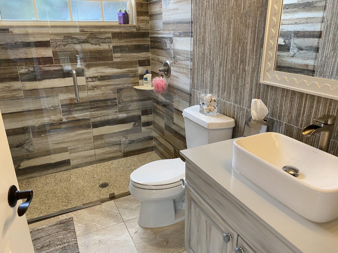 5900 Our Robbies Road Jupiter, FL 33458 - Photo 13 of 53 a bathroom with a sink a toilet and shower curtain