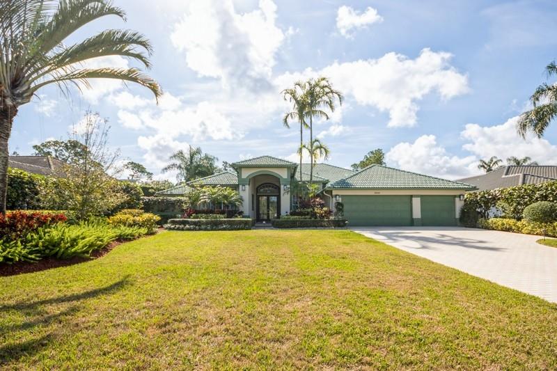 5900 Our Robbies Road Jupiter, FL 33458 - Photo 18 of 53 a front view of house with yard and swimming pool