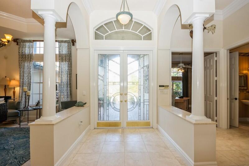 5900 Our Robbies Road Jupiter, FL 33458 - Photo 20 of 53 a view of an entryway with chandelier