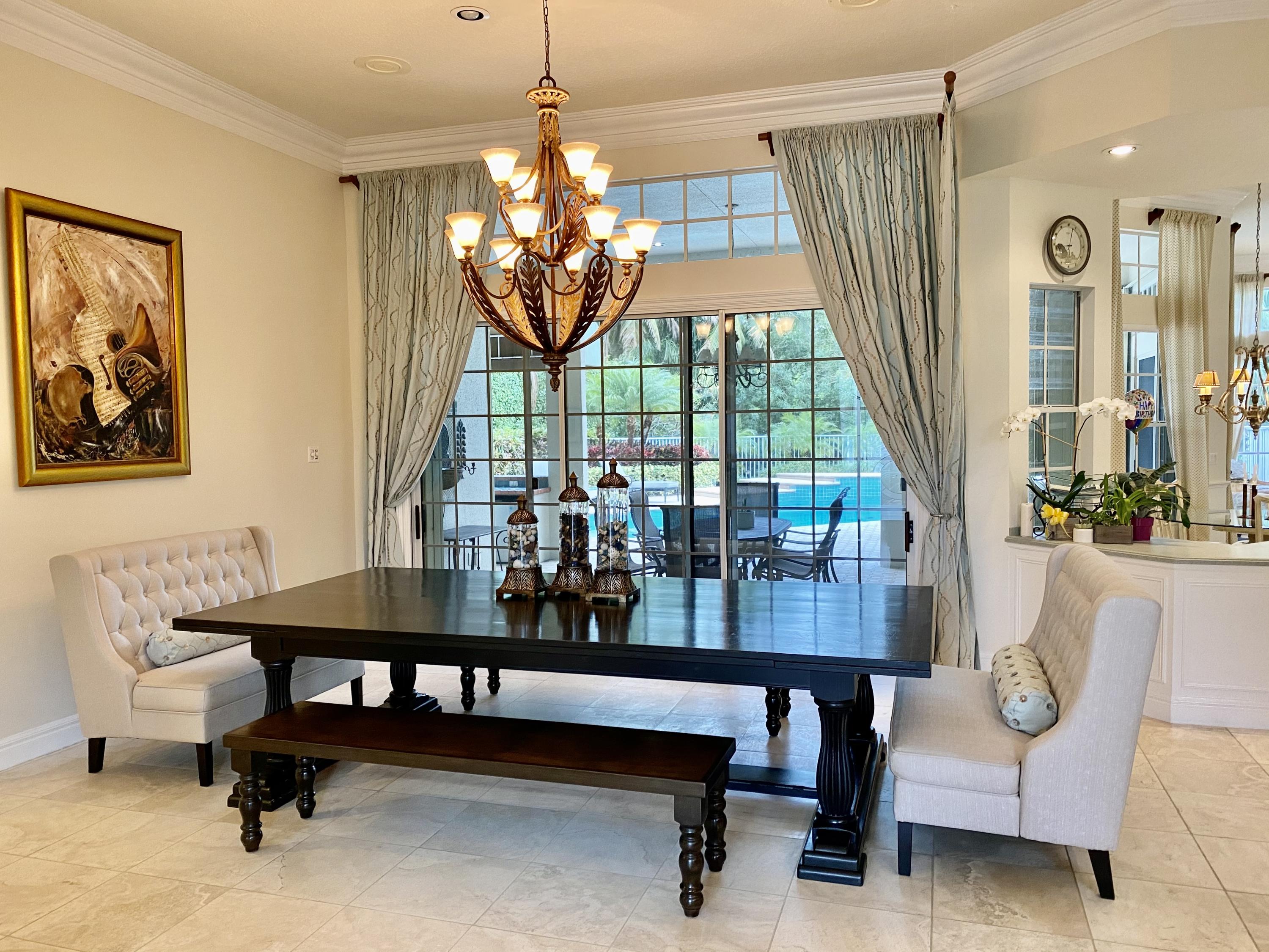 5900 Our Robbies Road Jupiter, FL 33458 - Photo 3 of 53 a view of a dining room with furniture window and outside view