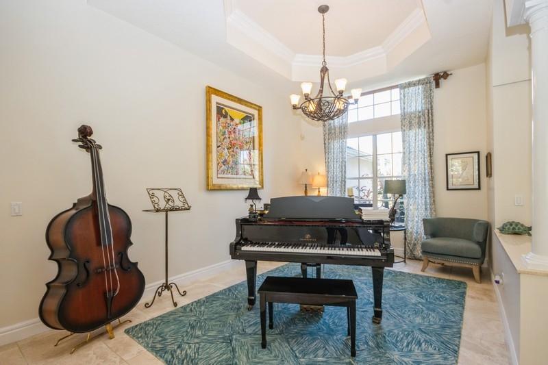5900 Our Robbies Road Jupiter, FL 33458 - Photo 23 of 53 a living room with furniture a window and a chandelier