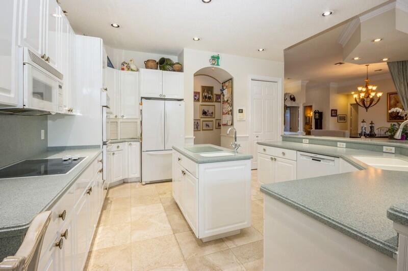 5900 Our Robbies Road Jupiter, FL 33458 - Photo 25 of 53 a kitchen with a sink stove and refrigerator