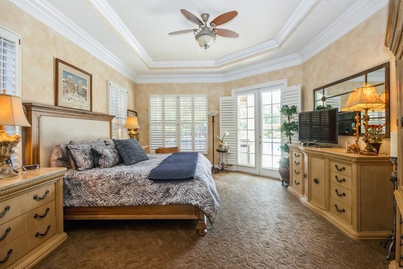 5900 Our Robbies Road Jupiter, FL 33458 - Photo 30 of 53 a bedroom with a large bed and a window