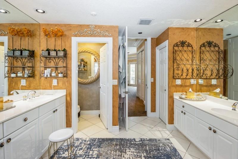 5900 Our Robbies Road Jupiter, FL 33458 - Photo 33 of 53 a bathroom with a granite countertop sink a toilet and shower