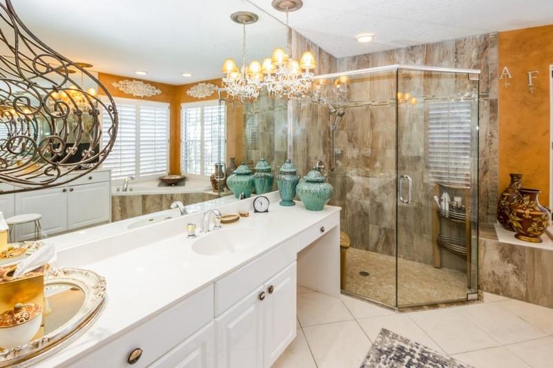 5900 Our Robbies Road Jupiter, FL 33458 - Photo 34 of 53 a bathroom with a double vanity sink mirror and shower