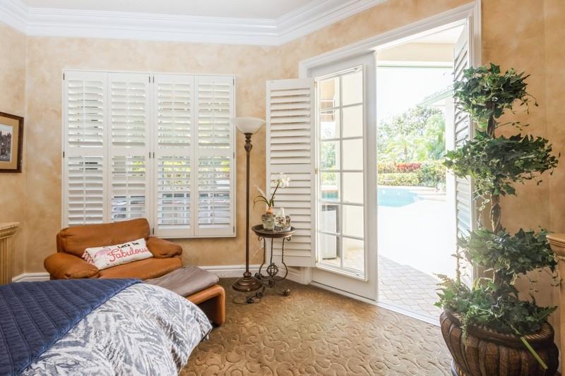 5900 Our Robbies Road Jupiter, FL 33458 - Photo 35 of 53 a bedroom with a bed and a potted plant