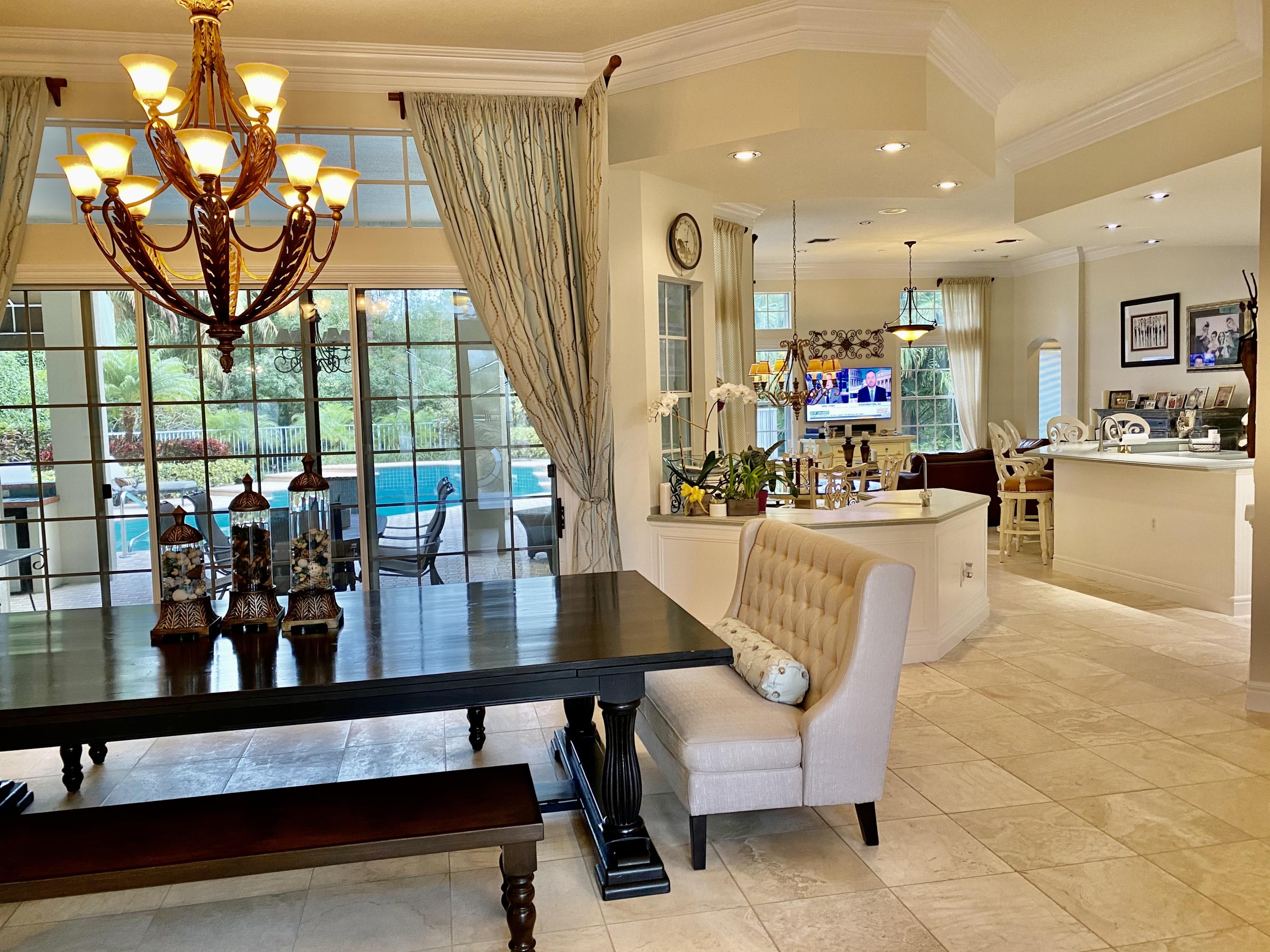 5900 Our Robbies Road Jupiter, FL 33458 - Photo 5 of 53 a living room with furniture and a large window