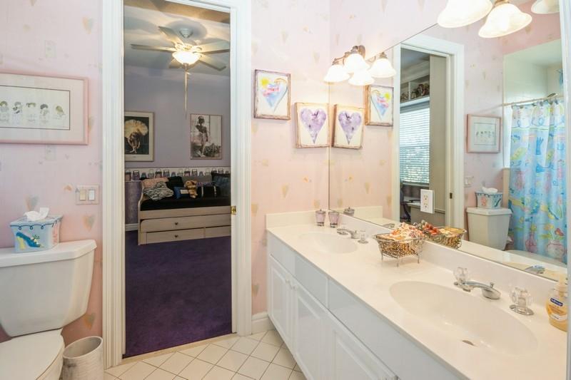 5900 Our Robbies Road Jupiter, FL 33458 - Photo 41 of 53 a en suite bathroom with a double vanity sink toilet and shower