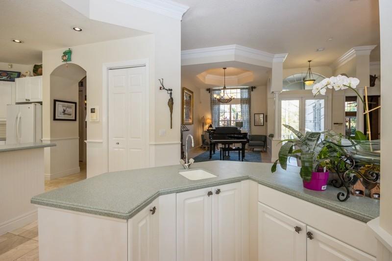 5900 Our Robbies Road Jupiter, FL 33458 - Photo 45 of 53 a kitchen with a sink and a refrigerator